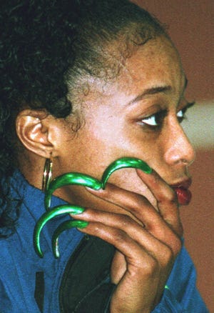 Two-time Olympic champion Gail Devers of the U.S. sports her long green finger nails at the indoor track and field meeting in Erfurt, eastern Germany, Feb. 5, 1997. Devers finished third in the 60m sprint.