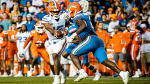 Florida Gators QB Anthony Richardson hands the ball off to RB Montrell Johnson.