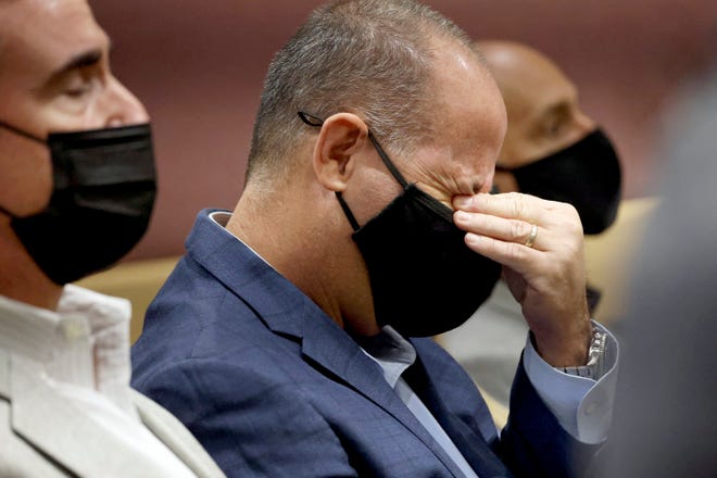 Fred Guttenberg, the father of slain student Jaime Guttenberg, wipes his eyes as Marjory Stoneman Douglas High School shooter Nikolas Cruz pleads guilty to all 17 counts of premeditated murder and 17 counts of attempted murder in the 2018 shootings, Wednesday, Oct. 20, 2021, at the Broward County Courthouse in Fort Lauderdale, Fla. Guttenberg is joining the top ranks of a progressive anti-gun group to promote like-minded political candidates around the country ahead of next year’s midterm elections. He will be a senior adviser to Brady PAC