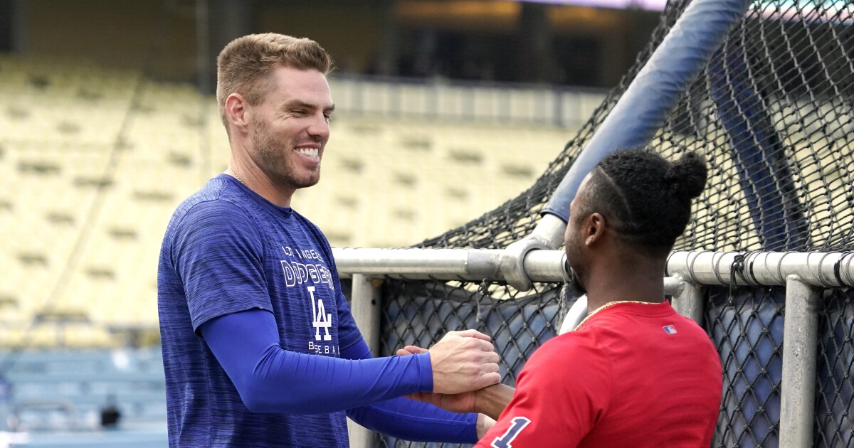 Freddie Freeman expresses himself with hugs and a homer in first game vs. Braves