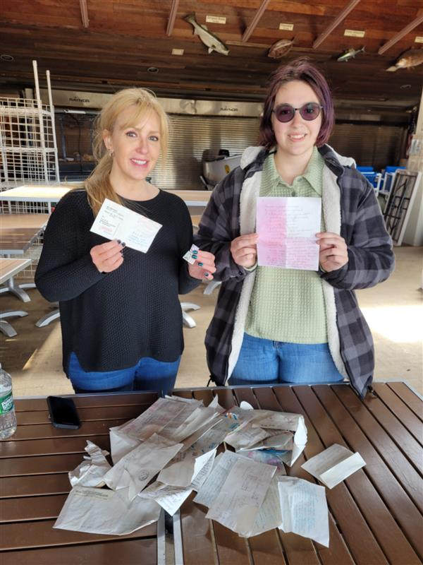 Tracy DeCillis and her daughter Shannon found a bag full of letters and cards written in the Russian language at Island Beach State Park.