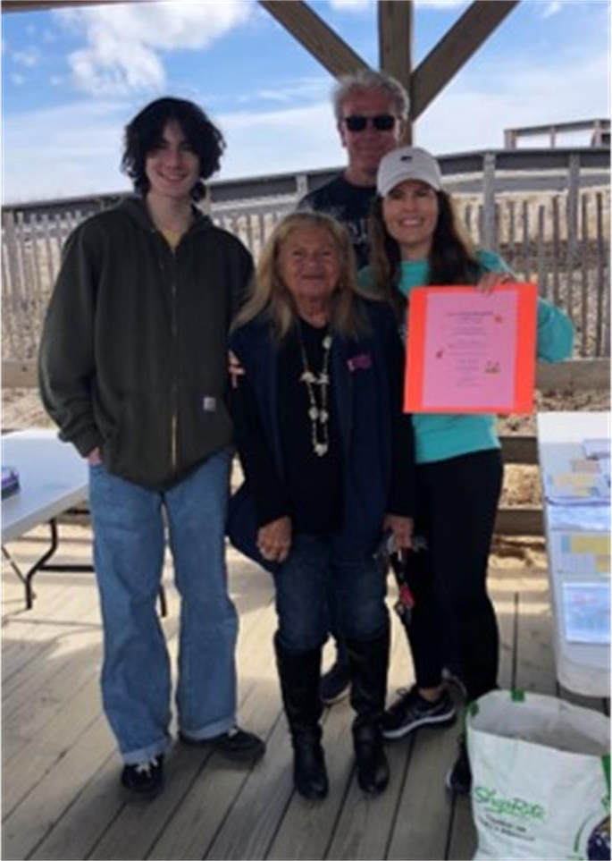 Lavallette Beach Captain Anita Zalom (center) celebrated her 35th year as a Captain on April 9! Also pictured are Junior Beach Captain Christian Orem (left) and members of the Lavallette Environmental Club.