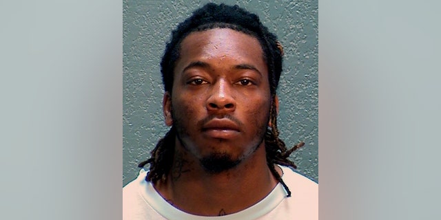 In this undated photo provided by the Arizona Department of Corrections, Rehabilitation and Reentry is Dandrae Martin. Police said they booked Dandrae Martin, 26, as a "related suspect" on charges of assault with a deadly weapon and being a convict carrying a loaded gun.