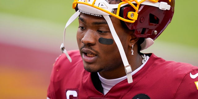 Washington Football Team quarterback Dwayne Haskins (7) before the start of an NFL football game against the Seattle Seahawks, Sunday, Dec. 20, 2020, in Landover, Md.