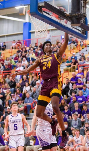 North's JaQualon Roberts (24) scores during the Bloomington North versus Bloomington South boys basketball sectional final at Martinsville High School on Saturday, March 5, 2022.