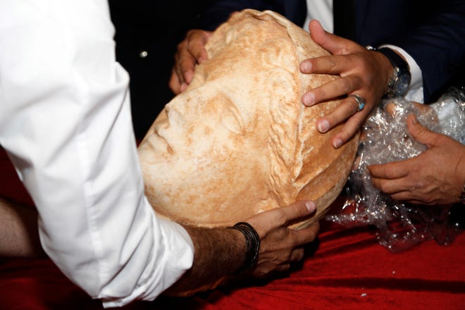 A Hellenic sculpture of a head from the ancient Libya city of Cyrene is displayed after it was returned by the United States to Libya on Thursday.