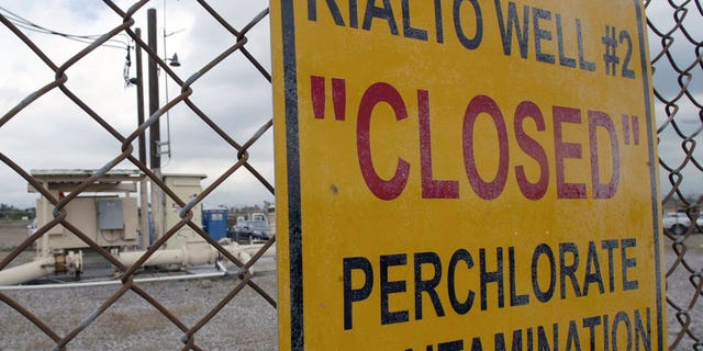 In this March 28, 2005, photo, a sign posted outside a water well indicates perchlorate contamination at the site in Rialto, Calif. 