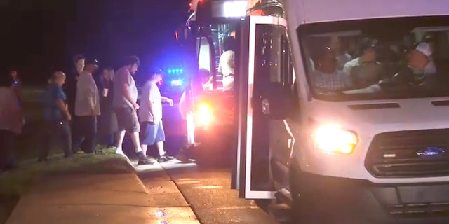 People boarding a bus in Anderson Country, South Carolina, Tuesday evening, when a shooting took place at a local FRÄNKISCHE facility. (WHNS)