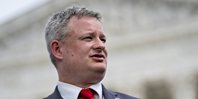 Ravnsborg speaks during a news conference outside the Supreme Court in Washington, D.C., U.S., on Monday, Sept. 9, 2019.