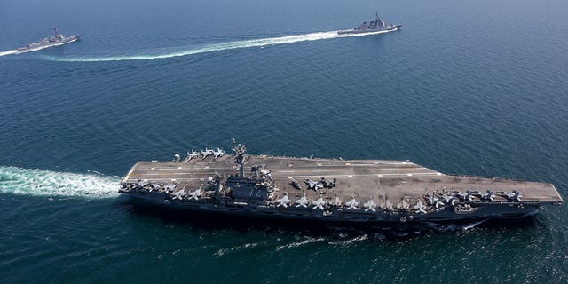 The USS Abraham Lincoln and other warships sail in formation in the Sea of Japan on April 13, 2022.