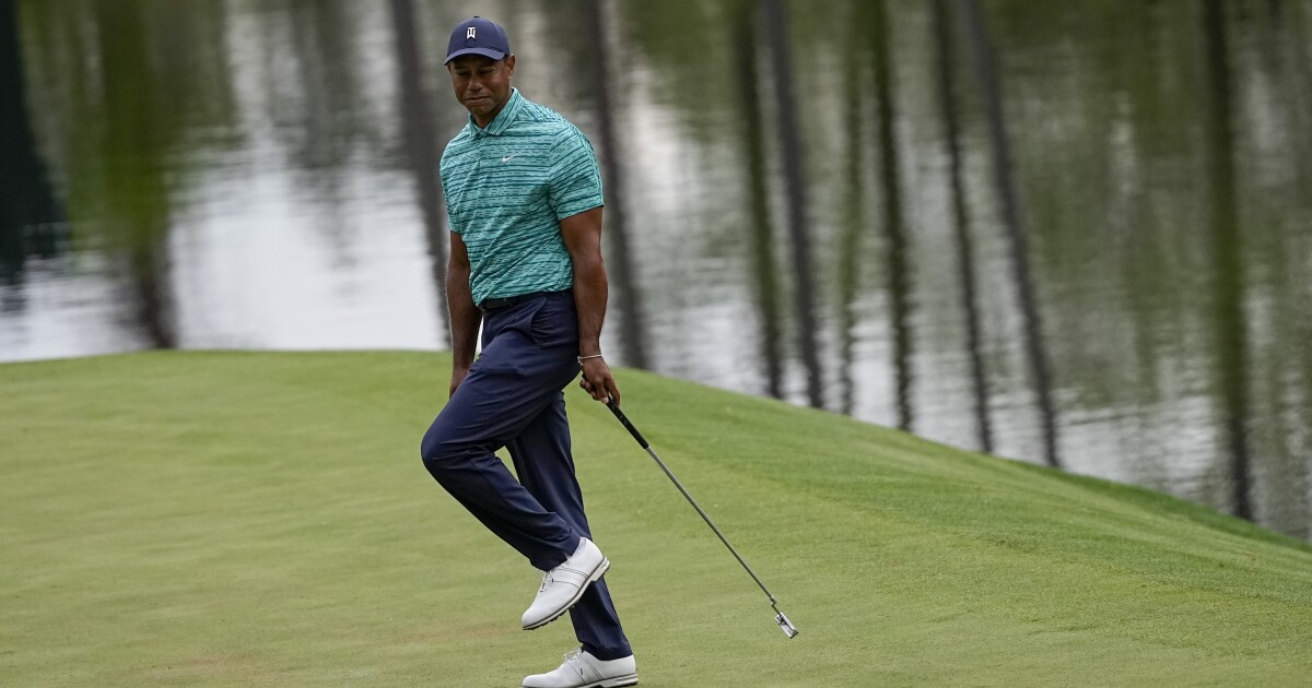 Tiger Woods rallies with four birdies and will make cut at Masters