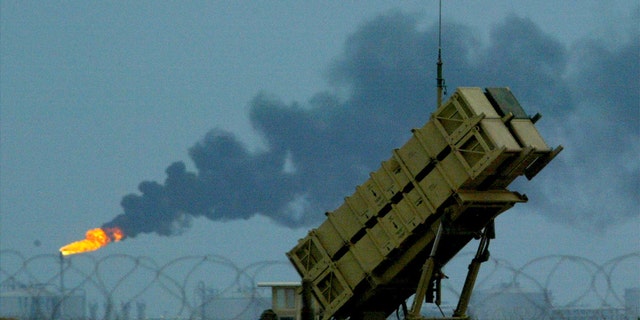 U.S.-manned Patriot missiles protect a nearby British and U.S airbase in front of the oil fields in Kuwait March 16, 2003. 