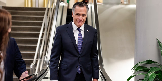 Sen. Mitt Romney (R-UT) walks through the Senate subway during a vote on Capitol Hill on February 16, 2022 in Washington, DC. 