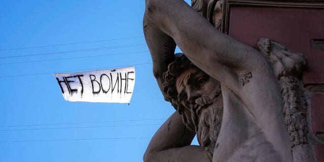 A poster that says "No War" hangs over Nevsky Prospect, the main street in St. Petersburg, Russia, on March. 1, 2022.