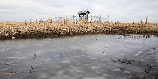 Frozen water pools in a cornfield near a Keystone pipeline pumping station in rural Milford, Nebraska, on Jan. 9, 2020.