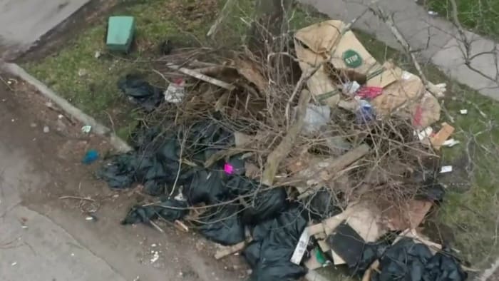 Illegal dumping: Detroit cleans up massive pile of trash across from school bus stop