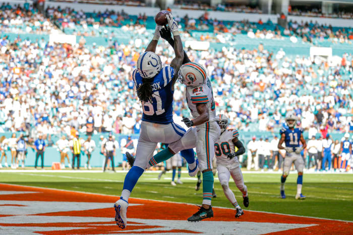 Oct 3, 2021; Miami Gardens, Florida, USA; Indianapolis Colts tight end Mo Alie-Cox (81) makes a catch in the end zone for a touchdown as Miami Dolphins free safety Eric Rowe (21) attempt to block the pass during the fourth quarter of the game at Hard Rock Stadium.