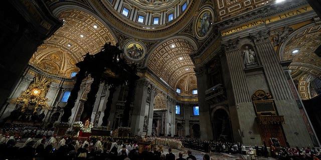 The Easter vigil ceremony in St. Peter's Basilica at the Vatican, Saturday, April 16, 2022.