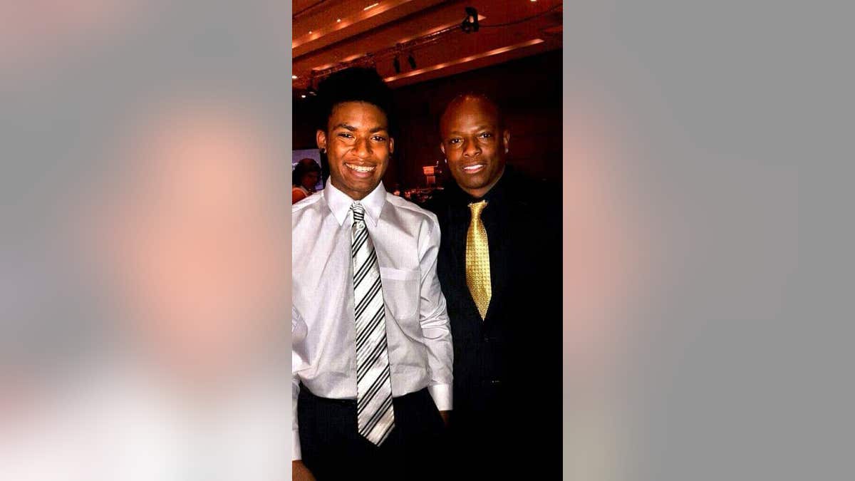 Daniel Robinson with his father