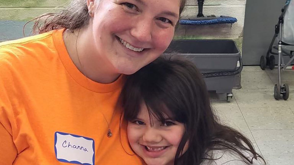 Channa Kelly hugging her daughter