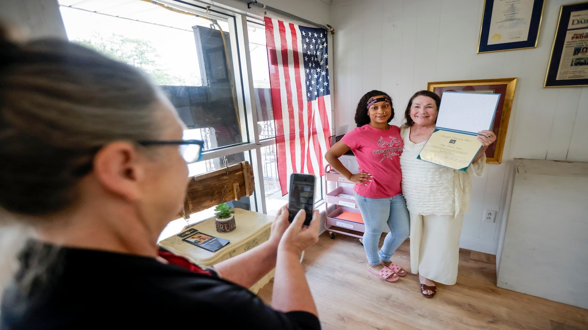 Woman receives diploma