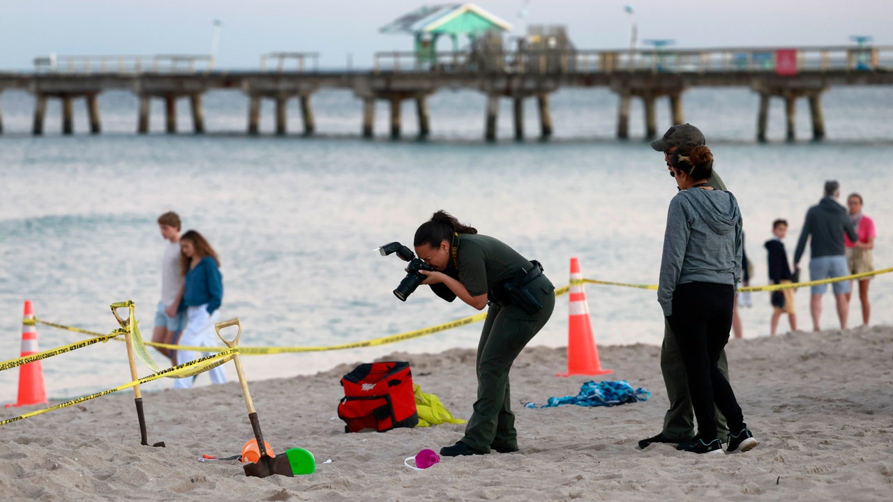 Girl buried alive while digging sand hole in Florida, brother injured