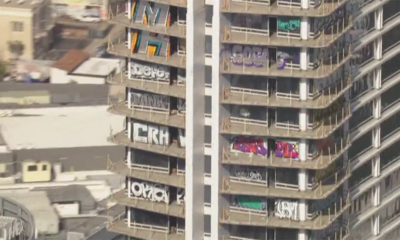 Taggers vandalize 27 floors of luxury Los Angeles high-rise left abandoned by Chinese developers