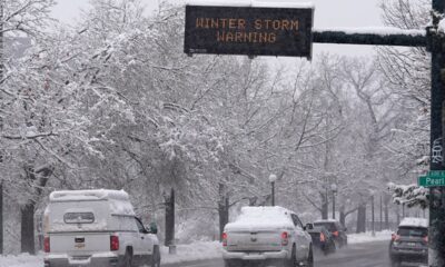 Snow piles onto Denver by the foot; airport, major highway shut down