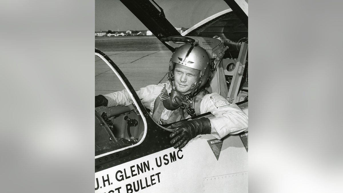 Photograph of John Glenn in the cockpit his F8U-1P Crusader during the "Project Bullet" record breaking transcontinental flight, 1957