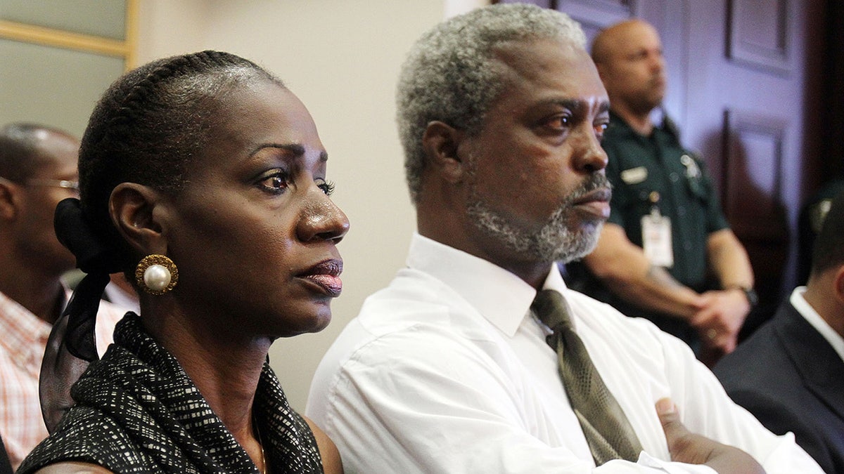 Pamela Champion and her husband looking somber in court.