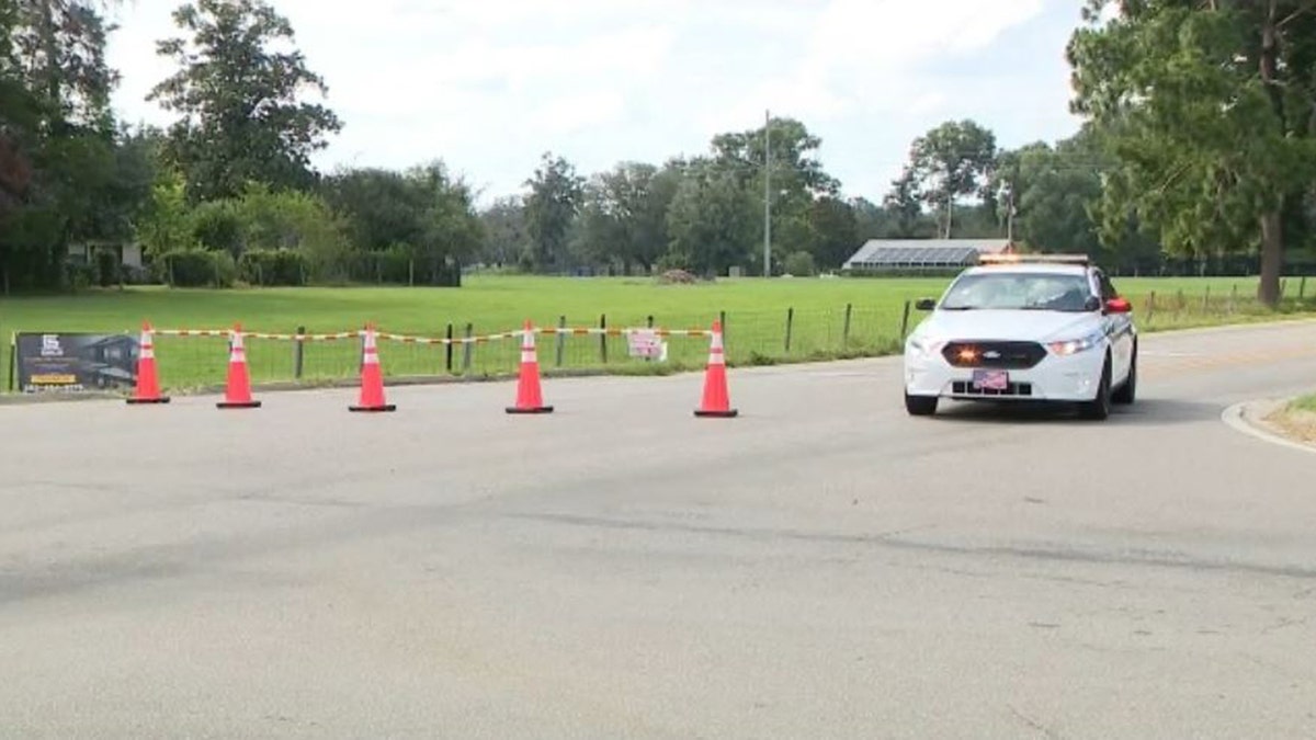 police car at scene of shooting