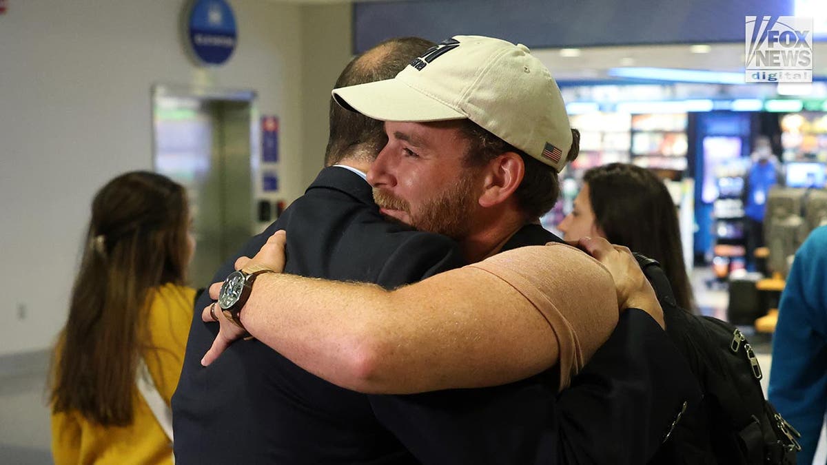 Tyler Wenrich arrives at the airport after being released from Turks and Caicos