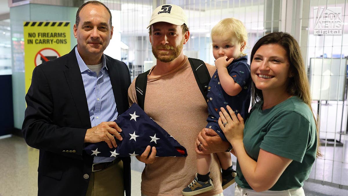 Tyler Wenrich arrives at the airport after being released from Turks and Caicos