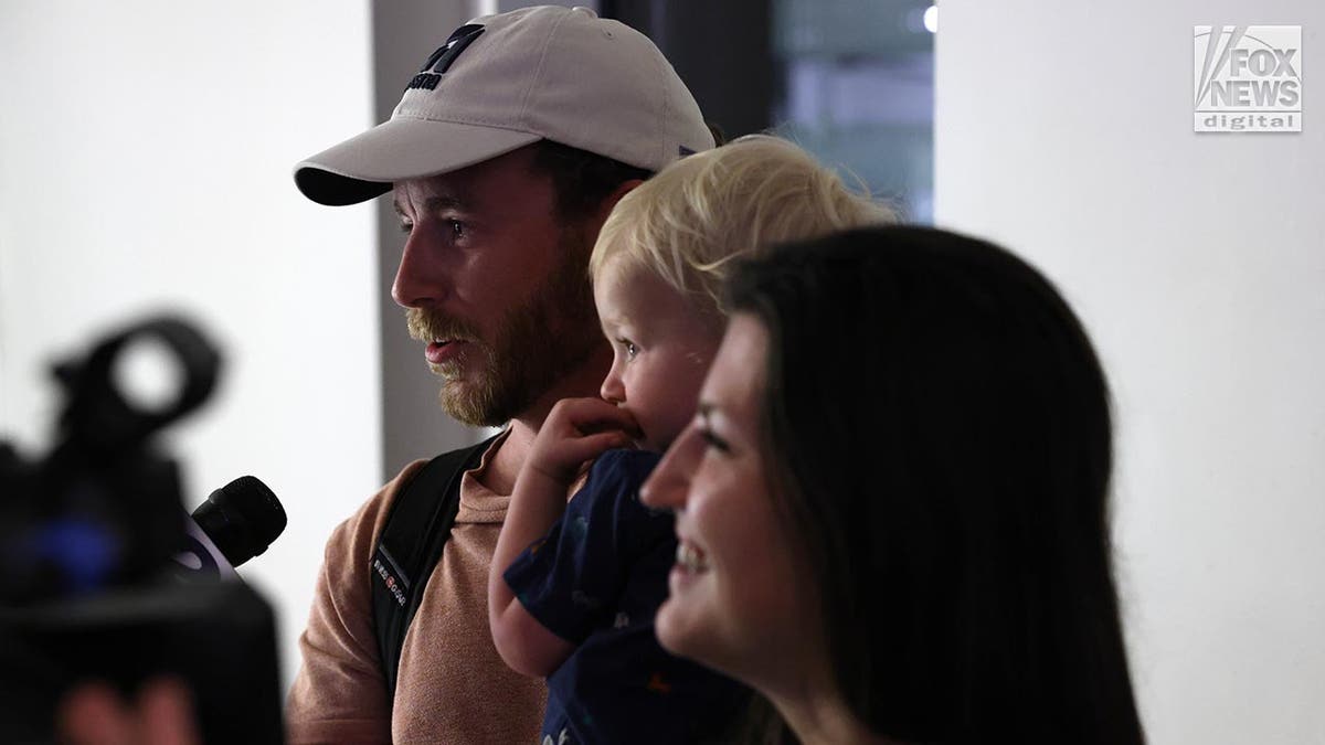 Tyler Wenrich arrives at the airport after being released from Turks and Caicos