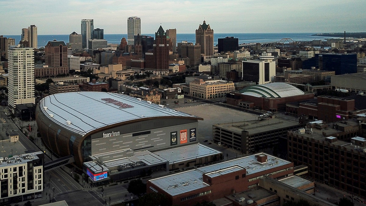 Fiserv Forum is seen with the Milwaukee skyline in 2020