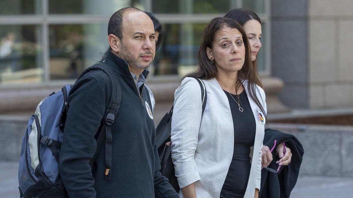 Nancy Iskander and her husband Karim leave Van Nuys Courthouse during a lunch break from a preliminary hearing for Rebecca Grossman