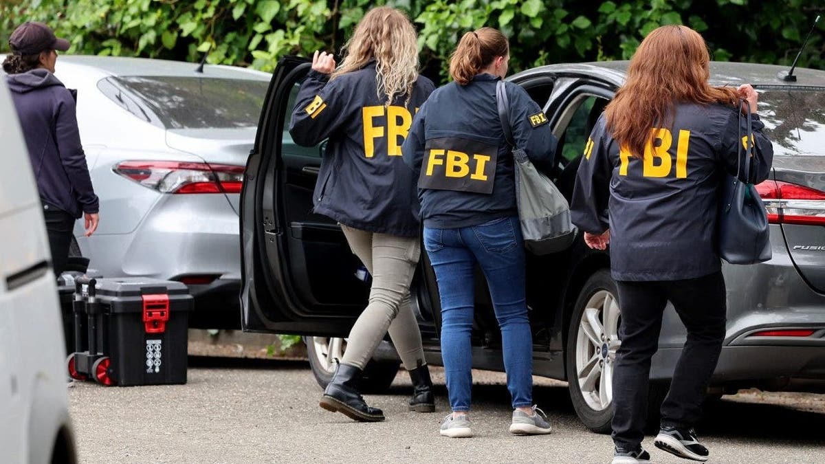 FBI agents get in their unmarked vehicles after a raid at a home associated with Oakland Mayor Sheng Thao in Oakland, Calif., on Thursday, June 20, 2024.