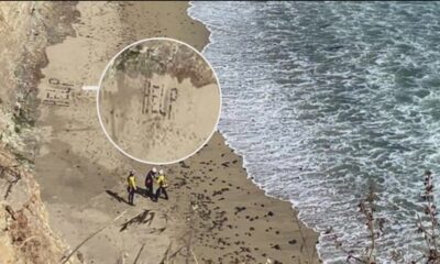 Kite surfer uses rocks to spell out 'HELP' in sand to prompt rescue at California beach