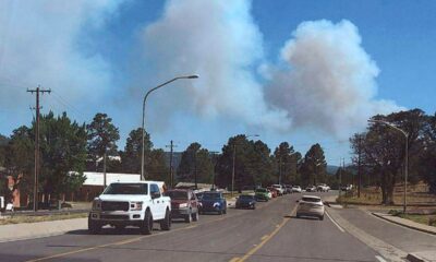 New Mexico village evacuated as quick-moving wildfires close in