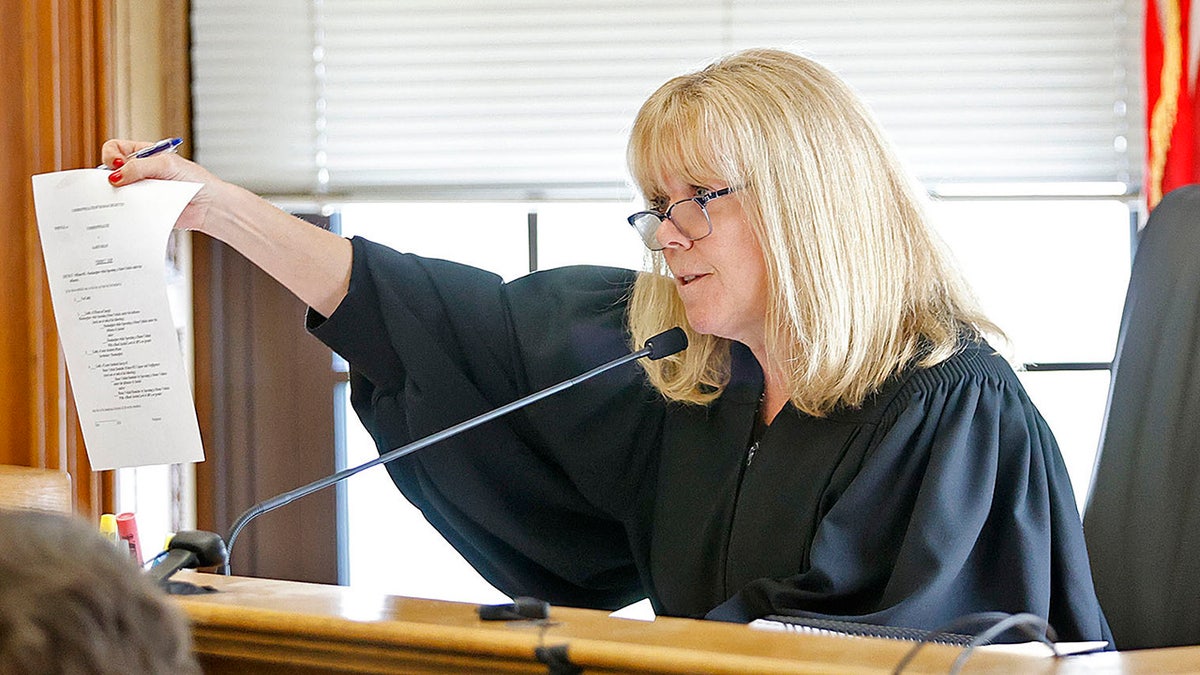 Judge Beverly Cannone looks over the verdict slip