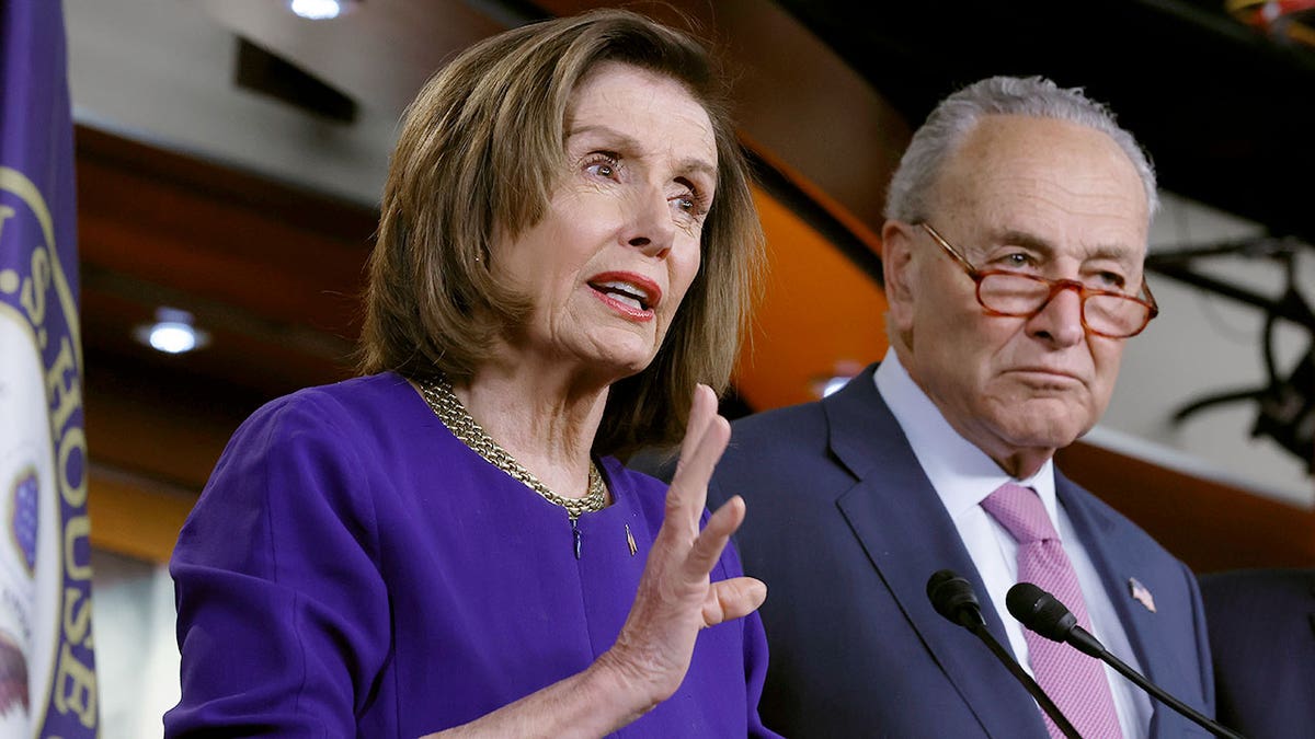 Nancy Pelosi with Chuck Schumer at news conference