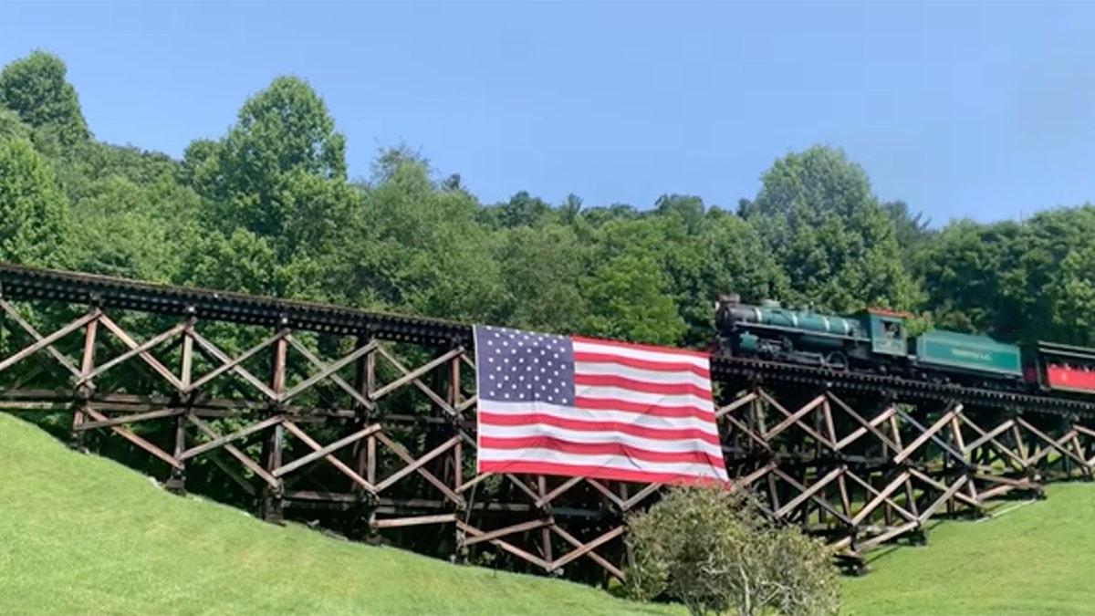Tweetsie Railroad bridge with draped American flag