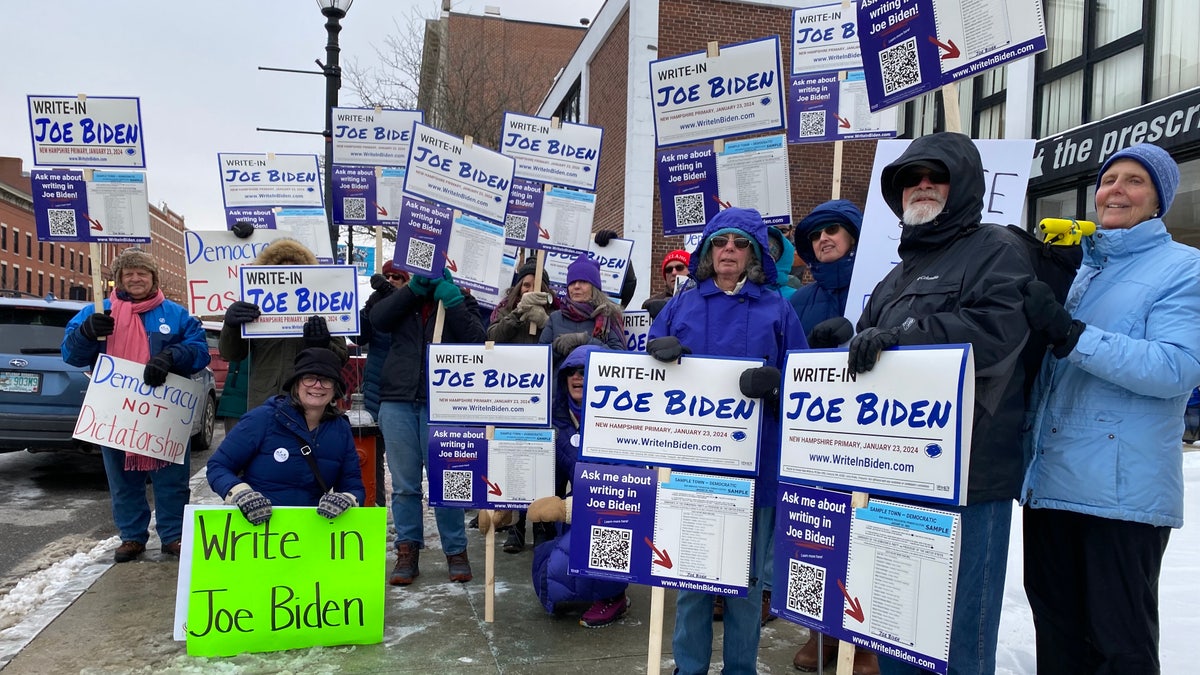 Supporters of the write-in Joe Biden effort in the New Hampshire primary stand for a photo in Concord, New Hampshire, on Jan. 19.
