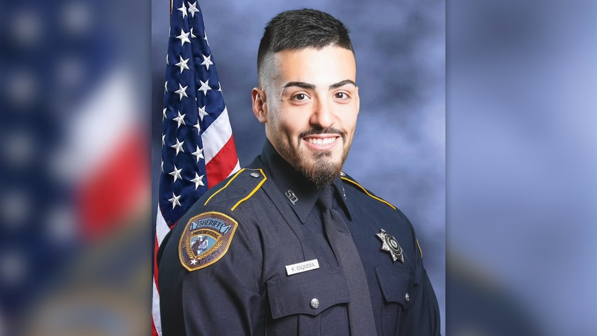 Harris County Sheriff's Deputy Fernando Esqueda in uniform in front of a US flag in this portrait provided by the sheriff.