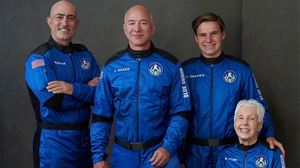Mark Bezos, brother of Jeff Bezos; Jeff Bezos, founder of Amazon and space tourism company Blue Origin; Oliver Daemen, of the Netherlands; and Wally Funk, aviation pioneer from Texas, pose for a photo.