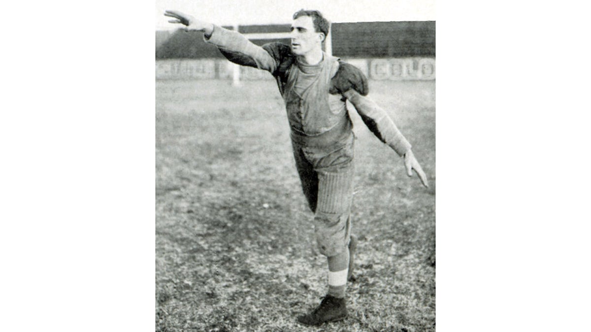 Bradley Robinson of SLU's Blue and White football team throws the "first" forward pass to John Schneider, in this reconstructed image of the first forward pass in collegiate football, Nov. 3, 1906. (Excerpted from a composite image on page 190 in the SLU Blue and White Yearbook for 1907.)