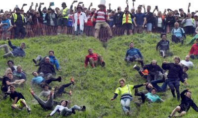 Annual cheese rolling race attracts thousands to England's Cooper’s Hill