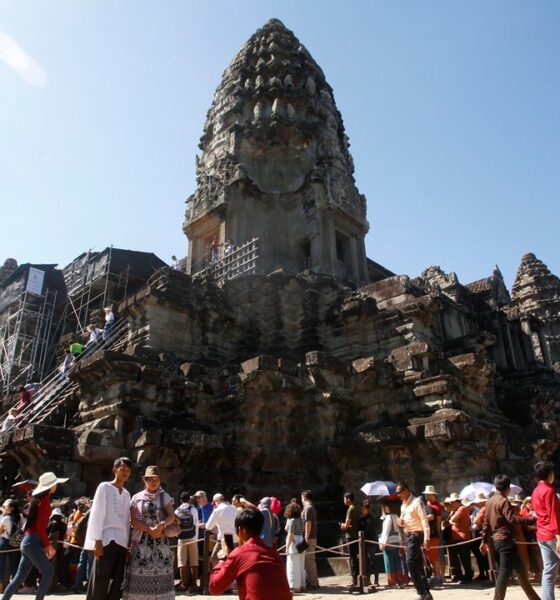 1 dead, 3 injured after storm blows down tree at Cambodian Angkor temple complex, damaging statues