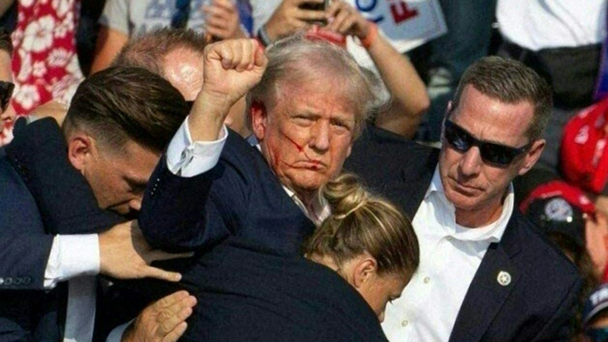 Trump holds fist