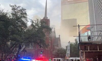 Smoke rises above the historic First Baptist Church in downtown Dallas